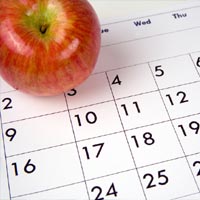 photo of a calendar (with an apple for teacher)